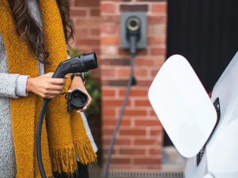 person plugging in car