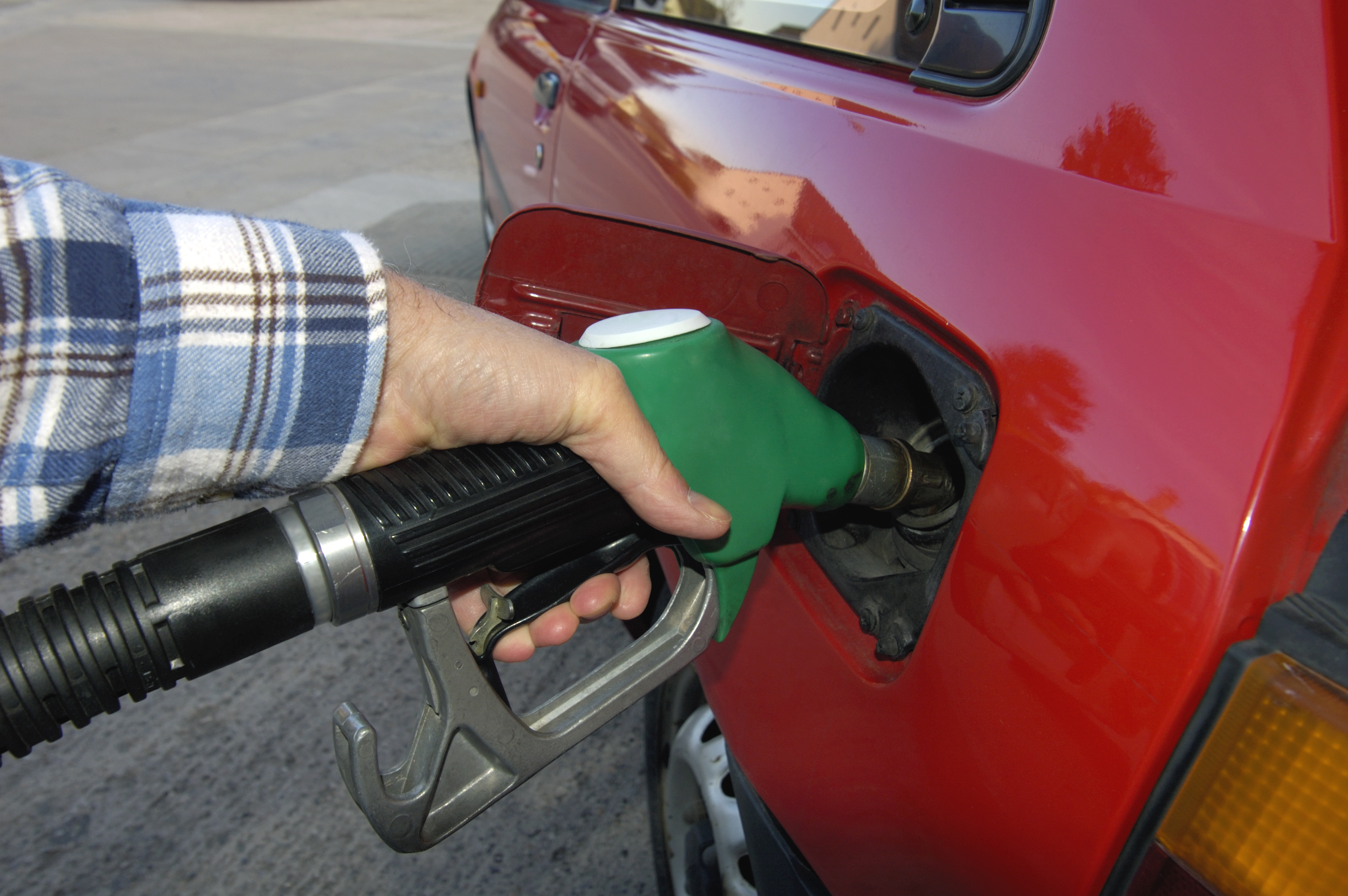 Person filling up their vehicle with petrol