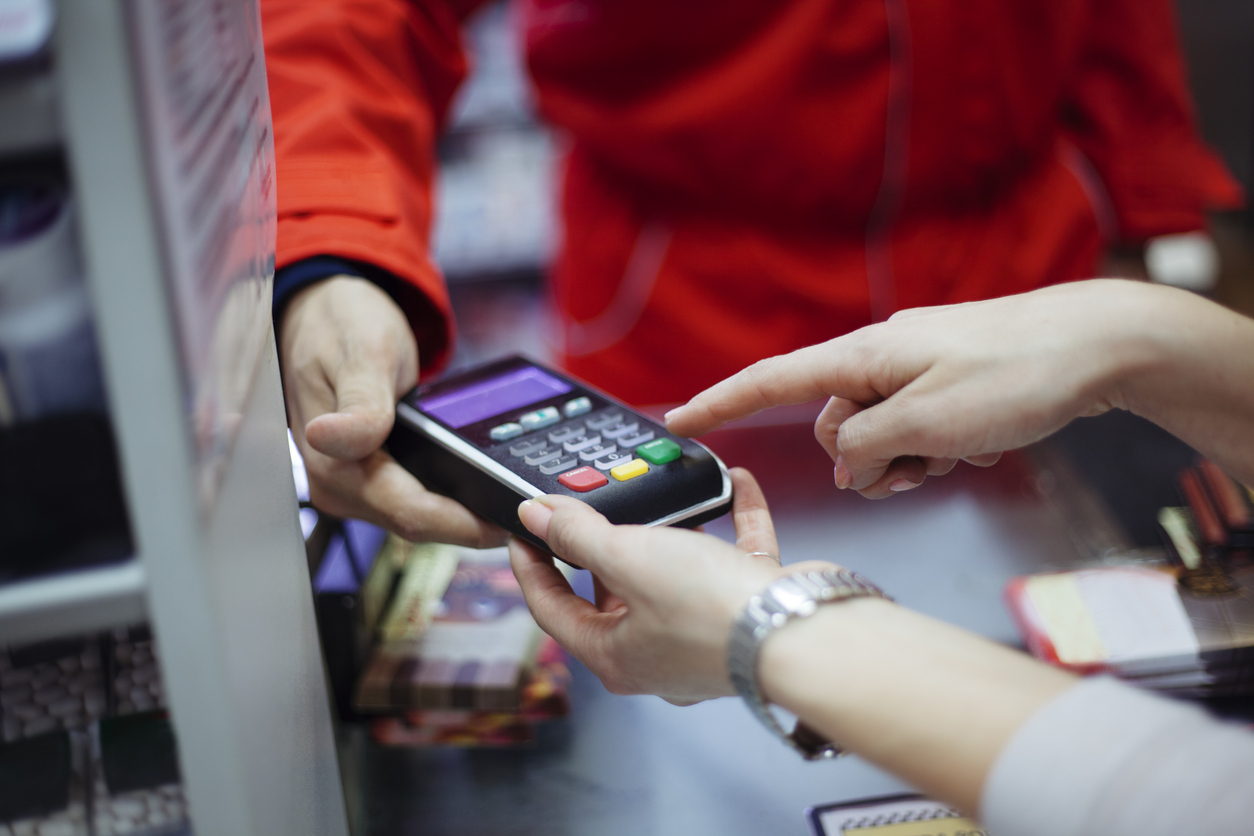 Person making a payment with a card machine