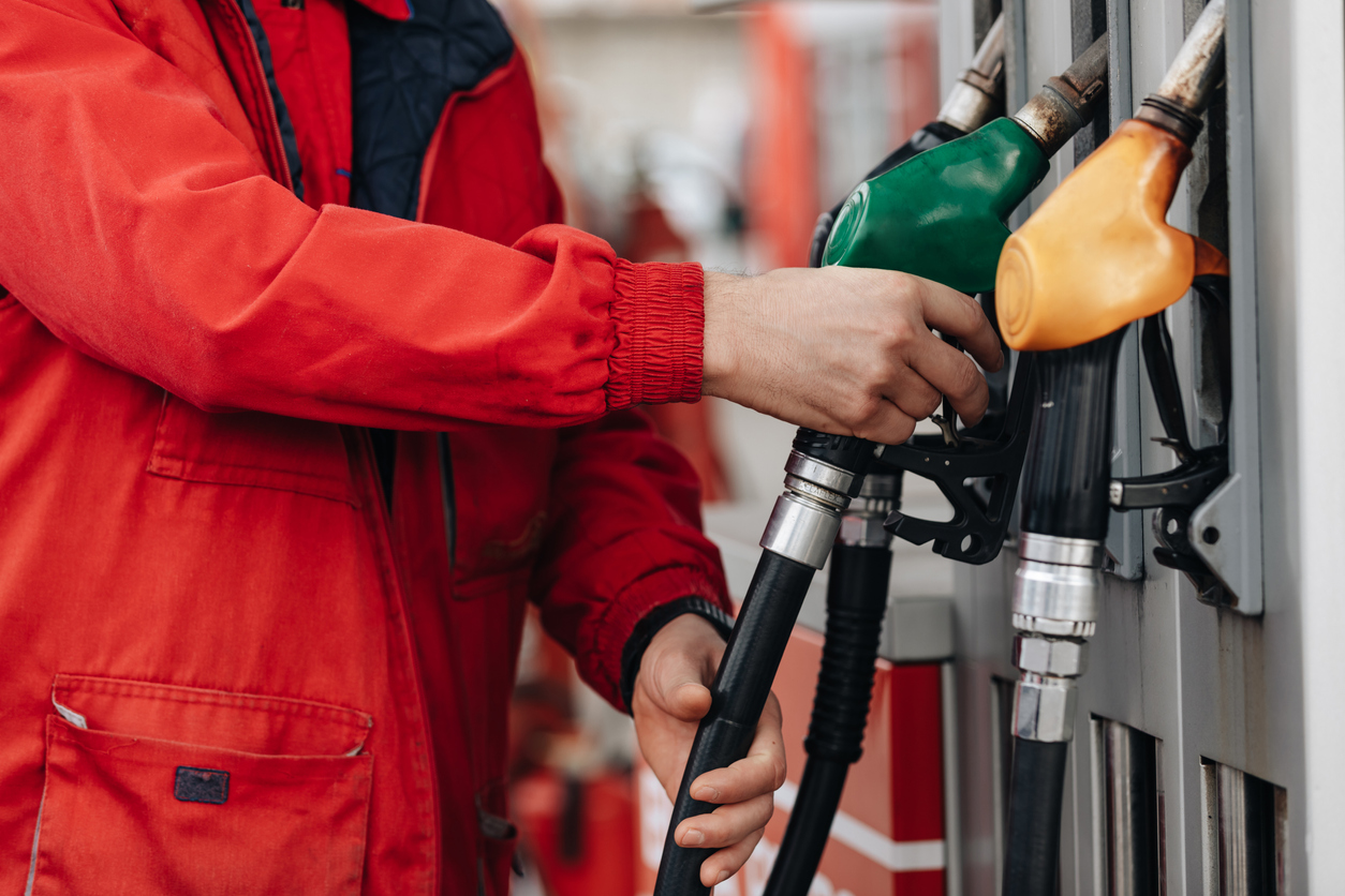 Person at fuel pumps