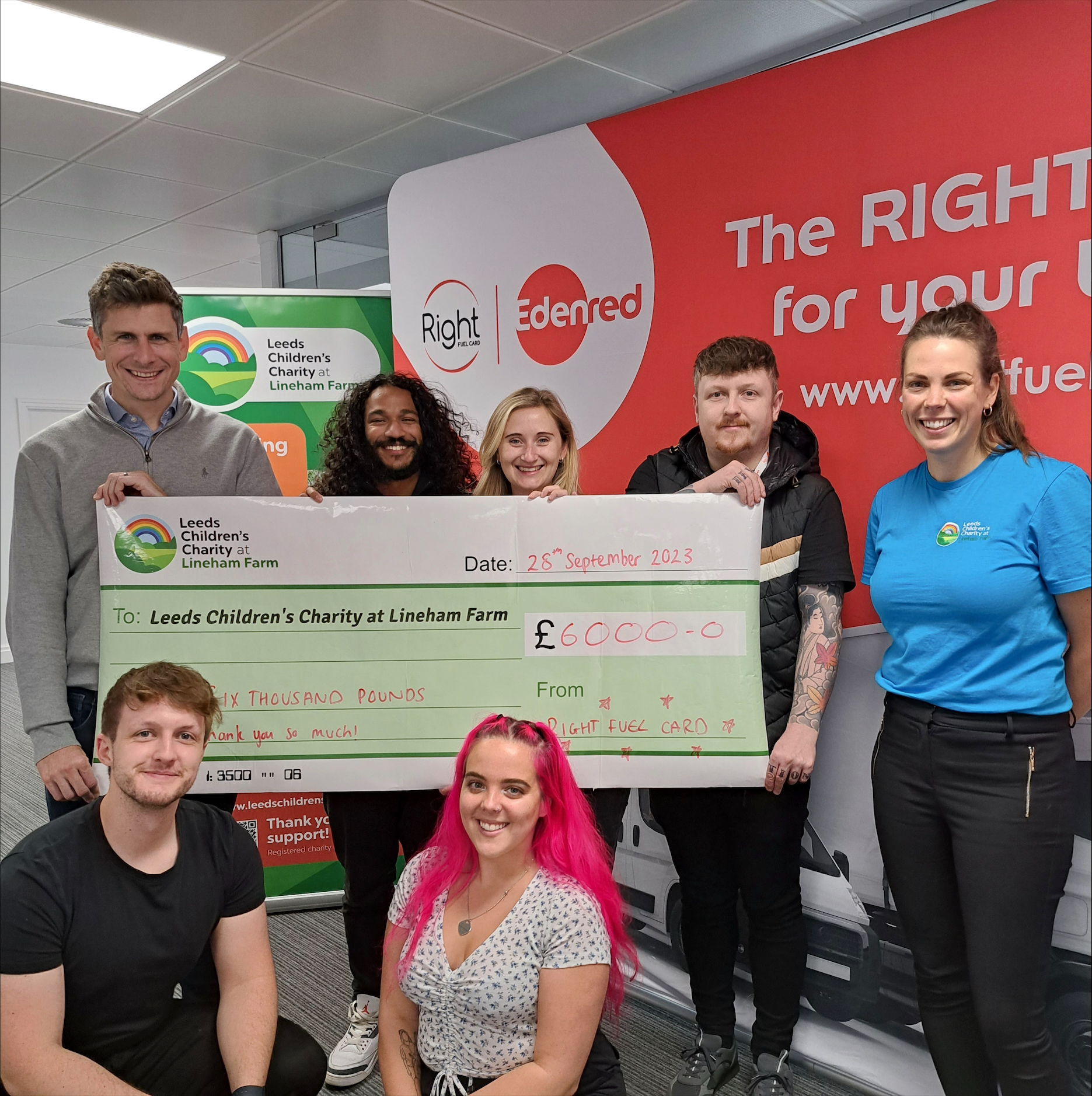 Group picture with giant cheque